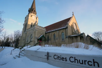 William Kelly at Minnesota church protest daring Attorney General Pam Bondi to take action