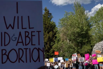 Wyoming Supreme Court building with people reacting after the ruling that keeps abortion legal in the state