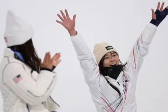 Choi Ga-on Stuns Chloe Kim to Win Halfpipe Gold at Milan-Cortina Olympics A New Star Rises in Women’s Halfpipe Seventeen year old Choi Ga-on delivered the performance of her life to deny Chloe Kim a historic third straight Olympic gold in women’s halfpipe at the Milan-Cortina Winter Olympics. Many expected Kim to make history. No snowboarder has ever won three consecutive Olympic halfpipe titles. But Choi had other plans. After a heavy fall in her opening run, the South Korean teenager bounced back with a stunning final attempt. She scored 90.25 points, the exact mark Kim posted in qualification a day earlier. Kim could not match it in her final run and had to settle for silver. The moment felt symbolic. Kim, long considered the face of women’s halfpipe, stood beside the young rider she once mentored. From Protégé to Olympic Champion Choi and Kim first met nine years ago at a test event before the PyeongChang Winter Olympics. Kim was 17 at the time and on her way to her first Olympic gold. Choi was just a child with big dreams. Recognizing her talent, Kim and her father helped Choi train in the United States. That support now forms part of an emotional full circle story. Choi had already built a strong reputation. In 2023, at age 14, she won X Games superpipe gold. She became the youngest rider ever to claim the title, breaking Kim’s record. That same year, she won her first World Cup event. A back fracture later cut her season short, but she returned stronger. Coming into the Olympics, she had won every World Cup event she entered this season. A Dramatic Final Under Pressure The final in Italy tested her mentally and physically. On her first run, Choi hit the icy lip of the pipe and crashed hard. She lay still for several moments as snow fell around her. Many thought her gold medal hopes were over. Instead of quitting, she reset. She admitted she cried after that fall. For a moment, she considered withdrawing. Then she told herself to continue. Her third run changed everything. She linked technical tricks with confidence and control. The crowd reacted with shock and applause as her score appeared. Her coach broke down in tears. Japan’s Mitsuki Ono claimed bronze with 85.00 points. Kim Fights Through Injury Kim entered the Games with limited preparation. She had competed only once this season. A training fall in Switzerland left her with a dislocated shoulder and a torn labrum. She rode in the final with her shoulder strapped in a brace. She opened with a strong 88.00 run and looked in control. But Choi’s final score increased the pressure. On her last attempt, Kim fell. That mistake ended her bid for a third straight gold. Despite the result, Kim expressed pride. She plans to undergo shoulder surgery after the Games. She said this silver medal means as much as her previous golds because she pushed herself fully. The Changing of the Guard Choi’s victory signals a shift in women’s halfpipe. The teenager who once looked up to Kim now stands as Olympic champion. The sport has a new leader, and her journey is only beginning.