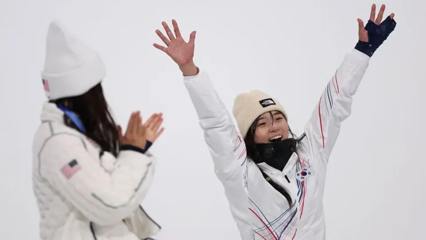 Choi Ga-on Stuns Chloe Kim to Win Halfpipe Gold at Milan-Cortina Olympics A New Star Rises in Women’s Halfpipe Seventeen year old Choi Ga-on delivered the performance of her life to deny Chloe Kim a historic third straight Olympic gold in women’s halfpipe at the Milan-Cortina Winter Olympics. Many expected Kim to make history. No snowboarder has ever won three consecutive Olympic halfpipe titles. But Choi had other plans. After a heavy fall in her opening run, the South Korean teenager bounced back with a stunning final attempt. She scored 90.25 points, the exact mark Kim posted in qualification a day earlier. Kim could not match it in her final run and had to settle for silver. The moment felt symbolic. Kim, long considered the face of women’s halfpipe, stood beside the young rider she once mentored. From Protégé to Olympic Champion Choi and Kim first met nine years ago at a test event before the PyeongChang Winter Olympics. Kim was 17 at the time and on her way to her first Olympic gold. Choi was just a child with big dreams. Recognizing her talent, Kim and her father helped Choi train in the United States. That support now forms part of an emotional full circle story. Choi had already built a strong reputation. In 2023, at age 14, she won X Games superpipe gold. She became the youngest rider ever to claim the title, breaking Kim’s record. That same year, she won her first World Cup event. A back fracture later cut her season short, but she returned stronger. Coming into the Olympics, she had won every World Cup event she entered this season. A Dramatic Final Under Pressure The final in Italy tested her mentally and physically. On her first run, Choi hit the icy lip of the pipe and crashed hard. She lay still for several moments as snow fell around her. Many thought her gold medal hopes were over. Instead of quitting, she reset. She admitted she cried after that fall. For a moment, she considered withdrawing. Then she told herself to continue. Her third run changed everything. She linked technical tricks with confidence and control. The crowd reacted with shock and applause as her score appeared. Her coach broke down in tears. Japan’s Mitsuki Ono claimed bronze with 85.00 points. Kim Fights Through Injury Kim entered the Games with limited preparation. She had competed only once this season. A training fall in Switzerland left her with a dislocated shoulder and a torn labrum. She rode in the final with her shoulder strapped in a brace. She opened with a strong 88.00 run and looked in control. But Choi’s final score increased the pressure. On her last attempt, Kim fell. That mistake ended her bid for a third straight gold. Despite the result, Kim expressed pride. She plans to undergo shoulder surgery after the Games. She said this silver medal means as much as her previous golds because she pushed herself fully. The Changing of the Guard Choi’s victory signals a shift in women’s halfpipe. The teenager who once looked up to Kim now stands as Olympic champion. The sport has a new leader, and her journey is only beginning.