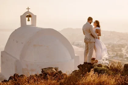 Where to Elope in 2026: Why Couples Are Choosing Intimate Destination Weddings Elopements Are Redefining Modern Weddings Elopements are no longer secret ceremonies. In 2026, they are stylish, intentional, and often set in breathtaking destinations. More couples now choose private ceremonies over traditional weddings. Instead of large guest lists and formal venues, they travel to remote locations and exchange vows in peace. These celebrations feel personal and meaningful, not performative. A Real Couple, A Personal Choice When Zanthe and Mark Howell got engaged in 2024, they already knew what their wedding would look like. They planned to marry in the Scottish Highlands. No guests. No spotlight. Just the two of them. Zanthe says they never felt comfortable being the center of attention. A big wedding did not reflect who they were. For them, traveling somewhere remote felt symbolic. It marked the start of their shared life in a quiet and powerful way. Their story reflects a growing trend. Many couples now choose intimacy over tradition. Why Elopements Are Rising in 2026 Several factors drive this shift. First, wedding costs continue to climb. In 2026, the average wedding in the UK costs around £21,000. In the United States, couples spend about $36,000. Those numbers push many couples to reconsider. By comparison, a destination elopement typically costs between $2,500 and $8,000. That price range makes it far more accessible. Couples can invest in travel, photography, and a memorable experience instead of a single large event. Second, family expectations often add pressure. Some couples want freedom from complicated planning and outside opinions. Eloping allows them to focus on their relationship, not logistics. Third, many couples value experiences over tradition. They prefer adventure, travel, and meaningful moments. A ceremony in the mountains, by the sea, or in a quiet forest feels more authentic to them. Stunning Remote Locations Take Center Stage Today’s elopements take place in dramatic settings. Think rugged coastlines, wild highlands, desert landscapes, or hidden islands. These backdrops create unforgettable memories without the need for elaborate décor. Couples now treat their wedding as a shared adventure. They hike together. They explore new cultures. They celebrate in places that feel special to them. Instead of planning for hundreds of guests, they focus on each other. A Chic and Intentional Way to Marry Modern elopements are not rushed decisions. Couples plan them carefully. They hire photographers, choose meaningful outfits, and design ceremonies that reflect their values. What once felt secret now feels empowering. In 2026, eloping represents freedom, financial sense, and emotional clarity. It allows couples to begin marriage on their own terms.