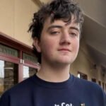 Tumbler Ridge Mass Shooting Leaves Small Canadian Town in Deep Mourning A quiet mountain town in western Canada is struggling to come to terms with an unthinkable tragedy. In Tumbler Ridge, nine people, including six children, lost their lives in one of the deadliest mass shootings in recent Canadian history. For years, residents believed serious violence could never reach their close knit community. That sense of safety has now been shattered. A Community That Felt Untouchable Tumbler Ridge is home to about 2,400 people. It sits along winding rural roads in the foothills of the Rocky Mountains. Many families work in the mining industry, which has shaped the town’s identity for decades. The area is also known for its natural beauty and its UNESCO recognised geopark, one of only five in Canada. Locals often left doors unlocked. Newcomers who took extra security measures were teased. Nothing like this had ever happened before. Now, that belief feels painfully naive. The Victims: Young Lives Cut Short Police confirmed the identities of the victims on Thursday. Among them was 12 year old Zoey Benoit. Loved ones described her as a brave and determined child. Another victim, 12 year old Kylie Smith, was remembered as the light of her family. She dreamed of attending art school in a big city one day. Flowers, teddy bears, and handwritten notes now line a memorial outside the local school. Each item reflects a life lost too soon. What Police Know So Far Investigators say 18 year old Jesse Van Rootselaar carried out the attack. Authorities found the suspect dead from a self inflicted gunshot wound at Tumbler Ridge Secondary School. Police stated that the suspect was born male and had begun transitioning to female about six years ago. Earlier that day, the suspect allegedly shot and killed their mother and step brother at a nearby residence. Officers later responded to reports of gunfire at the secondary school around 13:30 local time. The school has about 160 students. During the attack, dozens hid inside classrooms with their teachers. Seventeen year old Darian Quist said he and classmates barricaded themselves inside a mechanics classroom using metal tables. They stayed hidden for more than two hours before officers from the Royal Canadian Mounted Police and SWAT teams escorted them to safety. Grief That Touches Everyone Parents gathered at a community centre as they waited for news about their children. For some, the wait ended in heartbreak. Local pastor Tracy Krauss said nearly everyone in town knows someone directly affected. Even families who did not lose a loved one feel shaken. The suspect’s mother and step brother were also among the victims. Community members say the surviving relatives are grieving as well. The suspect’s father, Justin Van Rootselaar, told CBC News that he was estranged from his child. He offered condolences to all families impacted by what he called a senseless act of violence. Support has poured in from across the country. Canadian Prime Minister Mark Carney is scheduled to visit the town to offer his support. A Town Forever Changed Residents say the hardest part is that this happened in a place where everyone knows each other. The victims were not strangers. They were classmates, neighbours, and family friends. In Tumbler Ridge, grief now connects every household. The town may be small, but the loss feels immeasurable.