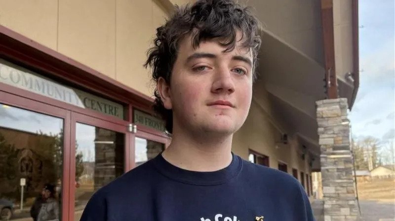 Tumbler Ridge Mass Shooting Leaves Small Canadian Town in Deep Mourning A quiet mountain town in western Canada is struggling to come to terms with an unthinkable tragedy. In Tumbler Ridge, nine people, including six children, lost their lives in one of the deadliest mass shootings in recent Canadian history. For years, residents believed serious violence could never reach their close knit community. That sense of safety has now been shattered. A Community That Felt Untouchable Tumbler Ridge is home to about 2,400 people. It sits along winding rural roads in the foothills of the Rocky Mountains. Many families work in the mining industry, which has shaped the town’s identity for decades. The area is also known for its natural beauty and its UNESCO recognised geopark, one of only five in Canada. Locals often left doors unlocked. Newcomers who took extra security measures were teased. Nothing like this had ever happened before. Now, that belief feels painfully naive. The Victims: Young Lives Cut Short Police confirmed the identities of the victims on Thursday. Among them was 12 year old Zoey Benoit. Loved ones described her as a brave and determined child. Another victim, 12 year old Kylie Smith, was remembered as the light of her family. She dreamed of attending art school in a big city one day. Flowers, teddy bears, and handwritten notes now line a memorial outside the local school. Each item reflects a life lost too soon. What Police Know So Far Investigators say 18 year old Jesse Van Rootselaar carried out the attack. Authorities found the suspect dead from a self inflicted gunshot wound at Tumbler Ridge Secondary School. Police stated that the suspect was born male and had begun transitioning to female about six years ago. Earlier that day, the suspect allegedly shot and killed their mother and step brother at a nearby residence. Officers later responded to reports of gunfire at the secondary school around 13:30 local time. The school has about 160 students. During the attack, dozens hid inside classrooms with their teachers. Seventeen year old Darian Quist said he and classmates barricaded themselves inside a mechanics classroom using metal tables. They stayed hidden for more than two hours before officers from the Royal Canadian Mounted Police and SWAT teams escorted them to safety. Grief That Touches Everyone Parents gathered at a community centre as they waited for news about their children. For some, the wait ended in heartbreak. Local pastor Tracy Krauss said nearly everyone in town knows someone directly affected. Even families who did not lose a loved one feel shaken. The suspect’s mother and step brother were also among the victims. Community members say the surviving relatives are grieving as well. The suspect’s father, Justin Van Rootselaar, told CBC News that he was estranged from his child. He offered condolences to all families impacted by what he called a senseless act of violence. Support has poured in from across the country. Canadian Prime Minister Mark Carney is scheduled to visit the town to offer his support. A Town Forever Changed Residents say the hardest part is that this happened in a place where everyone knows each other. The victims were not strangers. They were classmates, neighbours, and family friends. In Tumbler Ridge, grief now connects every household. The town may be small, but the loss feels immeasurable.