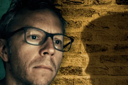 Dark Web Agent Spotted Bedroom Wall Clue to Rescue Girl from Years of Abuse A specialist online investigator uncovered a simple but powerful clue that helped rescue a young girl from years of abuse shared on the dark web. Greg Squire works with the US Department of Homeland Security Investigations in a unit that tracks and identifies children shown in online abuse material. Early in his career, he faced one of the most disturbing cases of his life. His team named the victim Lucy to protect her identity. A Case That Seemed Impossible to Crack Images of Lucy were circulating on hidden online forums. The offender carefully cropped and edited the photos to remove clear identifying details. Investigators could not trace her location or confirm her identity. From visible light sockets and electrical outlets in the background, Squire’s team confirmed that Lucy likely lived in North America. However, that clue was too broad to act on. They contacted Facebook, hoping facial recognition tools could help scan family photos. At the time, the platform said it did not have the tools to assist in that way. The team had to rely on careful visual analysis instead of advanced software. Searching Every Detail in the Room Investigators examined every item in Lucy’s bedroom. They studied her bedspread, clothes, stuffed toys, and furniture. Eventually, they found a small breakthrough. A sofa visible in several images was not sold nationwide. A company had distributed it only in certain regions. That detail reduced the potential customer base to around 40,000 people across 29 US states. Even so, the list remained overwhelming. Then Squire noticed the exposed brick wall in Lucy’s bedroom. The Brick That Changed Everything Squire contacted the Brick Industry Association and asked for help. The organization shared the photo with brick experts across the country. One expert, John Harp, immediately recognized the brick. He had worked in brick sales since 1981. He identified it as a “Flaming Alamo,” a brick produced from the late 1960s to the mid 1980s at a plant in the southwestern United States. Harp explained a critical fact. Bricks are heavy and expensive to transport long distances. Builders usually source them locally. That insight shifted the investigation. The team cross checked the sofa customer list with homes located within 100 miles of the brick factory. The number of potential addresses dropped sharply. Narrowing Down the Suspect From a refined list of about 40 to 50 names, investigators reviewed social media accounts. They found a photo of Lucy with an adult woman who appeared close to her. Authorities traced the woman’s address. They also reviewed other properties linked to her and people she had lived with in the past. The possible locations narrowed even further. Investigators avoided knocking on doors too soon. If they alerted the wrong address, they risked tipping off the suspect. Instead, they sent photos of suspected homes to the brick expert to compare masonry details. A simple brick pattern, hidden in plain sight, helped guide the team toward the right location and ultimately toward Lucy’s rescue.