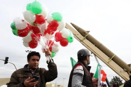 Iran Revolution Anniversary Rallies in Tehran Marked by Loyalty and Growing Discontent Massive Turnout in Tehran for Revolution Anniversary Tehran’s streets filled with large crowds as Iran marked the final day of its Islamic Revolution anniversary celebrations. Supporters of the government gathered in the capital and other major cities in a strong public display of loyalty. Officials treated the rallies as a direct response to recent anti government protests. Families walked together under a warm winter sun. The atmosphere felt festive. Children waved Iranian flags. Many people carried posters of Supreme Leader Ayatollah Ali Khamenei. Chants of “death to America” and “death to Israel” echoed through the streets, a familiar slogan at state organized events. The government’s most loyal supporters showed up in large numbers. Their presence sent a clear political message at a time when public frustration continues to grow over economic hardship. Support for the Revolution Still Runs Deep Many participants expressed strong pride in the 1979 revolution. A young woman wearing a long black veil described the revolution as a turning point for Iran. She said it revived the country and gave new life to society. In her view, its impact extended beyond Iran and influenced the wider Islamic world. Her words reflected a belief shared by many at the rally. For them, the revolution remains a source of identity and national strength. They see it as a symbol of independence and resistance against foreign influence. Acknowledging Economic Frustration At the same time, some supporters admitted that economic problems have caused real frustration. When asked about the recent protests, the young woman said that some people had valid concerns. She acknowledged that many Iranians struggle with rising prices and financial pressure. However, she drew a line between peaceful protest and unrest. She claimed that those who turned protests into chaos acted with motives linked to foreign actors. This argument mirrors the government’s stance. Officials often blame outside forces for fueling instability inside the country. Revolution Celebrations Overshadowed by Tension While the rallies projected unity and strength, they also highlighted divisions within Iranian society. The government aimed to show that it still commands strong public support. Yet the acknowledgment of economic dissatisfaction revealed deeper challenges. Iran continues to face international sanctions, inflation, and political pressure. These issues have sparked repeated protests in recent years. The anniversary events served both as a celebration and as a reminder of the tensions shaping the country today. As Iran reflects on decades since the revolution, the contrast between loyalty and defiance remains clear. Public celebrations showcased pride and commitment. But the undercurrent of economic frustration suggests that the conversation inside Iran is far from settled.