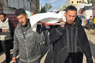 Israeli Strikes in Gaza Kill 20, Including Children and Paramedic Gaza City, February 4, 2026 – Israeli air and tank strikes in Gaza have killed at least 20 Palestinians, including several children and a paramedic. Nearly 40 more people were injured, local hospitals reported. The Israeli military said its forces targeted "terrorists" who had fired on troops in northern Gaza, seriously wounding an officer. The strikes took place near the Yellow Line, beyond which Israeli troops are stationed, and violated a three-month-old ceasefire with Hamas. Meanwhile, Hamas described the attacks as a "pretext to continue killing and aggression against our people." Children Among the Victims Al-Shifa Hospital in Gaza City received 13 bodies, including five children, after strikes hit tents for displaced families and nearby homes in the eastern Zeitoun and Tuffah neighborhoods. Abu Mohammed Haboush, a mourner at the hospital, said, "Our children were martyred – my son, my brother’s son, and daughter. We are peaceful people and had nothing to do with fighting." In Khan Younis, Nasser Hospital treated four dead, including a child, after strikes hit tents in the southern Qizan Rashwan area. Later, two sisters, Rahaf and Remas Abu Jamea, and paramedic Hussein al-Samiri died in the coastal al-Mawasi area. Paramedic Killed While Helping Victims Jihad al-Hinnawi, a first responder from Hamas-run Civil Defence, said Samiri ran to help victims of an earlier strike on a tent. Then a second strike hit the same location, killing him. The Palestinian Red Crescent condemned the attack and called it a "grave violation" of international humanitarian law, which protects medical personnel. Similarly, the International Committee of the Red Cross said it was "unacceptable" for first responders to face life-threatening risks while performing humanitarian work. IDF Targets Hamas Commander The Israel Defense Forces said their strike in al-Mawasi targeted Bilal Abu Assi, a platoon commander of Hamas’s elite Nukhba forces. They alleged he led attacks on Kibbutz Nir Oz and held hostages. The IDF added that it took measures to protect civilians but acknowledged that some, including medical personnel, were hit. Recent Escalations in Gaza On Sunday, more than 30 people died in Israeli strikes after gunmen emerged from a tunnel in southern Rafah. Gaza’s Hamas-run health ministry reports that Israeli fire has killed at least 556 people so far. In contrast, Israel reports that four of its soldiers have died in Palestinian attacks. The war began after Hamas attacked southern Israel on October 7, 2023, killing around 1,200 people and taking 251 hostages. Israel responded with a military campaign in Gaza. Since then, over 71,820 people have died in the territory, according to Gaza’s health ministry.