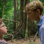 Acclaimed screenwriter Jack Thorne is set to present a profound new interpretation of William Golding’s seminal novel, Lord of the Flies, in an upcoming BBC series. Thorne, who first encountered the story through a borrowed—and somewhat illicit—copy from his mother, describes the book as leaving a “profound scar.” His adaptation aims to move beyond the common perception of the story as a simple tale of inherent malevolence. Beyond "The Evilness of Boys" Thorne challenges the idea that Lord of the Flies is merely shorthand for the “evilness of boys.” He sees deeper complexity within Golding’s work. For Thorne, the novel presents a “remarkably tender portrait” of young boys lost in an uncontrollable situation. This perspective aligns with his celebrated work on masculinity and violence, exemplified by his award-winning series Adolescence. Understanding the "Epitome of Evil" Thorne’s understanding of the characters evolved dramatically from childhood to adulthood. He initially saw the character Jack, the instigator of the island’s hunts, as the pure “epitome of evil.” Now, Thorne views Jack as a deeply complicated figure—a boy who is “as loving as he is hateful.” This nuanced understanding forms the heart of the new adaptation. A Structural "Relay Race" of Perspectives The four-part series uses a unique narrative structure to explore this complexity. Each episode bears the name of a key character, offering a deep dive into their individual perspective as the island descends into chaos. Thorne describes this approach as a “relay race,” moving from the rational Piggy, to the conflicted Jack, to the sensitive Simon, and finally to the elected leader Ralph. This structure allows viewers to literally “look into the eyes of someone that is fighting themselves.” Fostering Empathy and Conversation Director Marc Munden emphasizes that while the series does not excuse the characters' bad behaviour, it seeks to explain it. The team hopes to show how things can “go badly wrong,” reflecting a world where “confused little boys,” now in the guise of men, still create chaos. Thorne further envisions the series as an “empathy box,” sparking conversations between young viewers and their parents about navigating the difficulties of adolescence, much like his own childhood talks about TV dramas. A Challenging and Serious Production Filmed on location in Malaysia with a large cast of children, Munden admits the shoot was “chaos.” However, he praises the young actors, particularly the four leads, for taking their roles “very seriously.” The result aims to transform a story often seen as brutal and pessimistic into one that reveals, as Munden notes, a “lot of love” in its character portrayals.