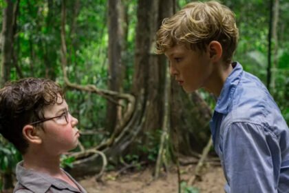 Acclaimed screenwriter Jack Thorne is set to present a profound new interpretation of William Golding’s seminal novel, Lord of the Flies, in an upcoming BBC series. Thorne, who first encountered the story through a borrowed—and somewhat illicit—copy from his mother, describes the book as leaving a “profound scar.” His adaptation aims to move beyond the common perception of the story as a simple tale of inherent malevolence. Beyond "The Evilness of Boys" Thorne challenges the idea that Lord of the Flies is merely shorthand for the “evilness of boys.” He sees deeper complexity within Golding’s work. For Thorne, the novel presents a “remarkably tender portrait” of young boys lost in an uncontrollable situation. This perspective aligns with his celebrated work on masculinity and violence, exemplified by his award-winning series Adolescence. Understanding the "Epitome of Evil" Thorne’s understanding of the characters evolved dramatically from childhood to adulthood. He initially saw the character Jack, the instigator of the island’s hunts, as the pure “epitome of evil.” Now, Thorne views Jack as a deeply complicated figure—a boy who is “as loving as he is hateful.” This nuanced understanding forms the heart of the new adaptation. A Structural "Relay Race" of Perspectives The four-part series uses a unique narrative structure to explore this complexity. Each episode bears the name of a key character, offering a deep dive into their individual perspective as the island descends into chaos. Thorne describes this approach as a “relay race,” moving from the rational Piggy, to the conflicted Jack, to the sensitive Simon, and finally to the elected leader Ralph. This structure allows viewers to literally “look into the eyes of someone that is fighting themselves.” Fostering Empathy and Conversation Director Marc Munden emphasizes that while the series does not excuse the characters' bad behaviour, it seeks to explain it. The team hopes to show how things can “go badly wrong,” reflecting a world where “confused little boys,” now in the guise of men, still create chaos. Thorne further envisions the series as an “empathy box,” sparking conversations between young viewers and their parents about navigating the difficulties of adolescence, much like his own childhood talks about TV dramas. A Challenging and Serious Production Filmed on location in Malaysia with a large cast of children, Munden admits the shoot was “chaos.” However, he praises the young actors, particularly the four leads, for taking their roles “very seriously.” The result aims to transform a story often seen as brutal and pessimistic into one that reveals, as Munden notes, a “lot of love” in its character portrayals.