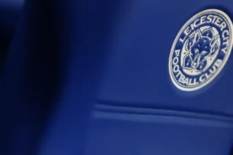 Leicester City Docked Six Points Over Financial Rule Breach Leicester City have lost six points after the English Football League ruled that the club broke financial regulations. The punishment takes effect immediately and pushes Leicester down the Championship table. The Foxes drop from 17th to 20th place and now sit just outside the relegation zone on goal difference. The decision comes at a difficult time for the club, both on and off the pitch. Why Leicester Were Penalised The Premier League charged Leicester in May for breaching profit and sustainability rules. The case covered the three year period ending in the 2023 to 2024 season. Under PSR rules, Premier League clubs cannot lose more than one hundred and five million pounds across three seasons. However, the allowed loss decreases by twenty two million pounds for every season spent outside the top division. Leicester spent part of that period in the Championship, which lowered their permitted spending limit. Club Losses Explained Leicester’s financial records show heavy losses over recent years. For the year ending June 30, 2024, the club reported a loss of nineteen point four million pounds. In the 2022 to 2023 season, Leicester confirmed losses of eighty nine point seven million pounds. The year before that, up to May 2022, the club recorded a record loss of ninety two point five million pounds. These figures do not include allowed adjustments. Clubs can exclude certain costs, such as stadium development and investment in women’s football, which both leagues consider beneficial to the sport. Leicester Responds to the Decision Leicester City strongly criticised the ruling. The club described the six point deduction as unfair and excessive. In an official statement, Leicester said the commission reduced the original punishment requested by the Premier League. However, the club believes the final decision still ignores key mitigating factors. Leicester confirmed they are reviewing the ruling carefully and weighing their next steps. The club also stressed its commitment to fair and transparent processes. On Field Struggles Continue The points deduction adds pressure to an already tough season. Leicester have failed to win their last four Championship matches and lost three of them. The club also remain without a permanent manager. Leicester dismissed Marti Cifuentes in January, leaving Andy King in charge as interim head coach. King will lead the team against Birmingham City on Saturday as Leicester fight to move clear of the relegation battle.