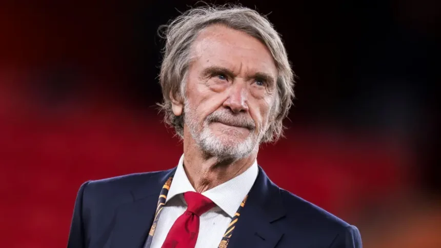 Jim Ratcliffe Immigration Comments Fallout: What It Means for Manchester United The fallout from Jim Ratcliffe’s immigration remarks continues to grow. The Manchester United co owner is now under review by The Football Association, and pressure is mounting from fans, politicians, and commercial partners. His words have triggered serious debate. The consequences could stretch far beyond headlines. FA Reviewing Possible Rule Breach The Football Association is reviewing whether Ratcliffe’s comments brought the game into disrepute. The governing body may charge him, issue a formal warning, or take no action. A charge would escalate the situation quickly. Even a warning would signal that football authorities take the matter seriously. The decision is expected soon. Manchester United Distances Itself Manchester United released a public statement emphasizing its inclusive and welcoming values. The club did not mention Ratcliffe directly. However, the message clearly created distance between the club and his remarks. Senior leadership approved the statement. That shows the level of concern inside Old Trafford. Ratcliffe later apologized. He said he regretted offending people but maintained that immigration policy should be controlled and well managed. Glazer Family and Brand Concerns The Glazer family, who still own 70 percent of the club, have not commented publicly. Sources suggest they were unhappy with the remarks. Manchester United operates as a global brand. Sponsors prefer to associate with positivity and inclusion. Political controversy creates risk, especially when commercial deals are already under pressure. The club currently lacks a training kit sponsor. Its sleeve sponsorship also expires this summer. Meanwhile, the Adidas agreement pays less after two seasons without Champions League football. Although United reported strong commercial revenue last year, competitors continue to close the gap. Stadium Project Could Face Challenges Ratcliffe invested £1.25 billion in 2024 for a 27.7 percent stake in the club. He also backs a proposed 100,000 seat stadium as part of a large Trafford regeneration plan. The project depends on cooperation from political leaders, including Greater Manchester Mayor Andy Burnham and Prime Minister Keir Starmer. Both criticized his comments. Public funding would support infrastructure around the stadium, not the stadium itself. Still, political relationships matter. This controversy arrives at a sensitive moment. One source close to the project said the situation caused real concern, even if it remains manageable. Supporter Reaction and Club Culture Fan groups responded quickly. The Manchester United Supporters Trust said leadership should make inclusion easier, not harder. The Manchester United Muslim Supporters Club called the apology a first step. Members want further reassurance that the club remains welcoming to all communities. Manchester United is one of the most globally diverse clubs in football. Its players, staff, and supporters come from many backgrounds. That makes language around immigration especially sensitive.