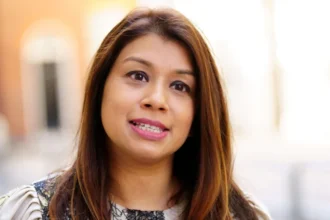 Former UK Treasury minister and Labour MP Tulip Siddiq has received a second prison sentence from a Bangladeshi court, deepening a legal dispute that has drawn strong criticism from the Labour Party. The court sentenced Siddiq to four years in jail on corruption charges. This punishment adds to a previous two year sentence handed down late last year. Judges also sentenced her aunt, former Bangladesh prime minister Sheikh Hasina, along with two other family members, in separate corruption cases. The court tried all defendants in absentia. Each of them denied the accusations. Labour Party condemns legal process Labour leaders quickly rejected the ruling and questioned the fairness of the trial. A party spokesperson said Siddiq never received proper details of the charges and had no chance to defend herself. According to Labour, Siddiq’s legal team made repeated requests to Bangladeshi authorities for information. Officials did not respond. The party stressed that every accused person deserves the right to legal representation. Because of these failures, Labour said it cannot accept the judgment. Background of earlier conviction In December 2025, a Bangladeshi court convicted Siddiq in another corruption case. Judges ruled that she influenced her aunt to use special executive powers to secure land on the outskirts of Dhaka. That conviction resulted in a two year prison sentence. Siddiq strongly rejected the ruling and described the entire process as deeply flawed. She said she remains confused by the case and claims Bangladeshi authorities have never contacted her directly, despite making allegations for more than a year. Resignation from UK government role Questions about Siddiq’s links to Sheikh Hasina led to her resignation from the UK government in January 2025. She stepped down as a Treasury minister after scrutiny over her use of London properties linked to allies of her aunt. The prime minister’s ethics adviser, Sir Laurie Magnus, reviewed the matter. He found no evidence of wrongdoing but said Siddiq should have shown greater awareness of reputational risks. In her resignation letter, Siddiq said she acted transparently but chose to step aside to avoid distracting the government. Political turmoil in Bangladesh Bangladesh launched the cases against Hasina and her family after her removal from power. Hasina ruled the country for 15 years before mass protests forced her out in August 2024. She later fled to India. In a separate case last year, a court sentenced her to death over crimes against humanity linked to a violent crackdown on student demonstrations.