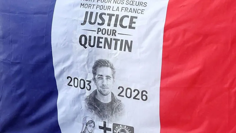 Student Death in Lyon Sparks Political Tension for French Far Left The death of a 23 year old student in Lyon has triggered a political storm in France, with senior ministers pointing fingers at far left activists. Quentin Deranque, a maths student and nationalist campaigner, died on Saturday. He suffered severe head injuries after a violent street assault two days earlier. Prosecutors say at least six people attacked him, kicking and punching him during the incident. An autopsy confirmed fatal damage to his skull and brain. What Happened in Lyon? The violence followed a small protest in Lyon on Thursday afternoon. Deranque had shown support for Némésis, a hard right feminist group. The group staged a demonstration against a visit by LFI Member of the European Parliament Rima Hassan to the city’s Institute of Political Studies, known as Sciences Po. Video recorded near the protest shows several young men being chased and beaten by a larger group. One man, believed to be Deranque, lay motionless on the ground after the attack. State prosecutor Thierry Dran said two groups first clashed briefly. Later, Deranque and two other nationalist activists tried to leave the area. A larger group cornered them and launched a second assault. Two members of Némésis were also injured during the earlier confrontation. Government Blames Far Left Militants Ministers in President Emmanuel Macron’s government quickly blamed far left activists for the killing. Interior Minister Laurent Nuñez described the attack as a “mob killing.” He said the attackers may not have intended to cause death, but their actions proved fatal. Justice Minister Gérald Darmanin was more direct. He stated that the far left killed Deranque and said there was no doubt about responsibility. Police have opened a murder investigation. Officers are working to identify suspects, but authorities have not made any arrests so far. Pressure on France Unbowed and Security Group The case has increased pressure on the radical left party France Unbowed, also known as LFI. Attention has also turned to La Jeune Garde, a group previously linked to security at LFI events. Members of Némésis claim they recognized activists from La Jeune Garde during the disruption of their protest. The group denies any involvement in the violence. Rima Hassan condemned the incident and called for a full investigation. She stated on social media that LFI provided her only security during the visit and said party members had no role in the assault. Family Responds Deranque’s lawyer, Fabrice Rajon, rejected claims that his client worked as a security agent. He said Deranque never engaged in violent activity and defended his political views peacefully. The incident comes at a tense moment in French politics, just weeks before key municipal elections. The investigation continues as authorities try to determine who carried out the deadly attack.