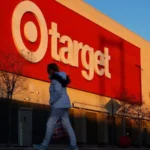 Target Cuts 500 Jobs as It Refocuses on Store Growth Target has announced it will cut around 500 jobs across its regional offices and distribution centers in the United States. The company says this move will help it invest more money and resources directly into its stores. Executives shared the decision with employees through an internal email on Monday. The company believes these changes will allow it to strengthen store operations and attract more customers. Reorganization Aims to Boost Store Staffing Along with the job cuts, Target is reorganizing its geographic store districts. Leaders say this step will free up resources so the company can increase staffing levels in stores where support is needed most. Management plans to add more labor hours and provide new training focused on improving the overall guest experience. Company leaders say enhancing in store service remains a top priority for future growth. New CEO Begins Strategic Changes These changes mark one of the first major decisions by Target’s new chief executive, Michael Fiddelke. He took over leadership last year as the retailer struggled with stagnant sales that have lasted more than four years. The latest cuts follow an earlier round of layoffs announced in October. At that time, Target eliminated about 1,800 corporate positions, which represented roughly eight percent of its global corporate workforce. Although this round is smaller, it shows that the company continues to shift investments away from corporate roles and toward store level improvements. Retail Challenges Continue Target has long built its brand on affordable fashion, groceries, home products, electronics, and toys. However, recent economic pressure has changed customer spending habits. Many shoppers now limit purchases to essentials and avoid non essential items such as clothing and electronics. These categories make up nearly half of Target’s total sales. The company has also dealt with supply chain shortages and public criticism over its decision to end diversity, equity, and inclusion targets. In addition, recent immigration enforcement actions in Minneapolis created internal tension. Last month, authorities detained two workers inside a suburban Minneapolis Target store. After the incident, more than 300 employees signed a letter urging company leaders to take action and address concerns about enforcement activity on store property. A Push to Win Back Customers Target now hopes that stronger store staffing, better training, and improved customer service will help rebuild momentum. Leadership believes that investing directly in stores can restore growth and bring shoppers back through the doors. The company has not yet shared full details about how much it plans to invest in store improvements. However, the direction is clear. Target wants to strengthen the in store experience as competition in retail continues to grow.