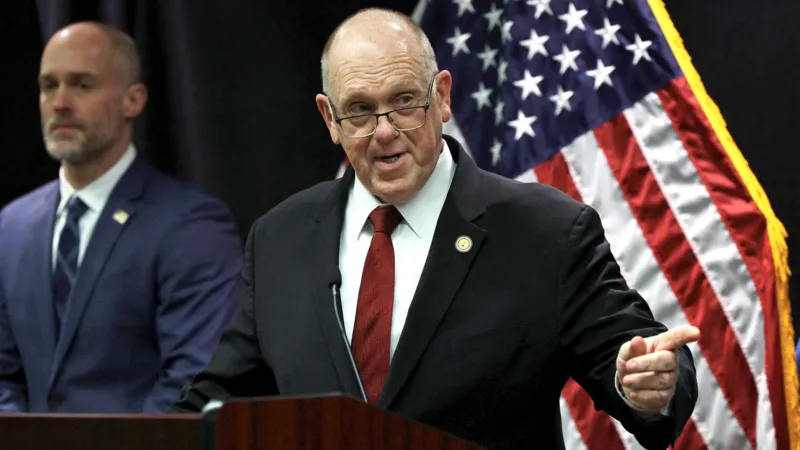 The Trump administration has announced plans to withdraw 700 federal immigration agents from Minnesota. These officers were part of Operation Metro Surge, a major immigration crackdown launched in Minneapolis late last year. White House Border Czar Tom Homan shared the decision during a press conference in Saint Paul on Wednesday. He said the pullback would start immediately. Federal Presence to Be Reduced Gradually According to Homan, agents from Immigration and Customs Enforcement and the US Border Patrol will be included in the withdrawal. Around 2,000 federal agents will remain in Minnesota for now. Homan explained that the administration wants to return to the staffing level that existed before the operation began in December. He said the decision reflects improved cooperation from state and local authorities. He added that federal officials will continue adjusting the number of agents based on local support and coordination. Body Cameras a National Priority During the briefing, Homan said the government is prioritizing body worn cameras for all officers operating in Minnesota. He confirmed that every federal agent in Minneapolis will receive the equipment. The administration also plans to expand body camera use nationwide. Homan said the move aims to improve transparency and accountability during enforcement actions. Operation Called a Success Despite Controversy Homan described Operation Metro Surge as a success, even though it faced legal challenges and public criticism. The operation has sparked nationwide protests and intense debate. Two US citizens, Renee Good and Alex Pretti, died after federal agents shot them during enforcement actions. Their deaths remain a major point of concern for civil rights groups. Homan acknowledged that the operation was not perfect. He said federal agencies improved coordination by creating a clearer chain of command. He noted that the operation now runs more smoothly than before. Arrest Numbers Highlight Enforcement Impact Federal agents have arrested hundreds of individuals since the operation began. Homan said officers detained people accused of serious crimes. These include 14 individuals charged with homicide, 139 charged with assault, 87 registered sex offenders, and 28 alleged gang members. The BBC has not independently confirmed these figures. Homan said the goal of the operation was to remove dangerous individuals from communities. He stressed that public safety remains the administration’s top priority. Cooperation Led to Agent Reduction Homan took direct control of the operation at the end of January. At the time, he said federal staffing would depend on how much support local officials provided. On Wednesday, he said Minnesota authorities showed unprecedented cooperation. That cooperation, he said, led to the decision to cut the federal presence by roughly one third.