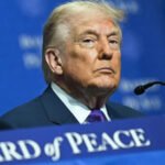 Trump’s Foreign Policy Dilemma Deepens Amid Rising Iran Tensions Tensions between the United States and Iran have put President Donald Trump’s foreign policy back in the spotlight. During a recent meeting of the Board of Peace, a Middle East coalition he created, Trump delivered a fresh warning to Tehran. He called for peace but also threatened military action. That contrast shows the core struggle shaping his second term. Diplomacy or Military Pressure? Trump says he prefers a diplomatic agreement that would end Iran’s nuclear weapons ambitions. A White House official recently said Iran would be “very wise” to reach a deal. However, the administration has increased pressure in recent weeks. Trump ordered a major military buildup in the Middle East. Analysts describe it as the largest US deployment in the region since the Iraq War in 2003. This approach raises questions. Trump often signals he wants negotiations. At the same time, he strengthens military options. That mix leaves allies and critics unsure about his final goal. The Shadow of Past Military Action Some observers argue that Trump uses strong language to gain leverage. Yet recent history suggests his threats carry weight. Earlier this year, the US carried out an operation against Venezuela. That mission led to the capture of former President Nicolás Maduro. The administration defined the objective narrowly and claimed success. Iran presents a more complex challenge. Trump insists that a US strike last June “obliterated” Iran’s nuclear facilities. If that is true, critics ask why another strike would be necessary. The White House has not clearly explained its new targets or expected results. Nuclear Talks at a Standstill Washington and Tehran have held indirect talks. These discussions focus on uranium enrichment and Iran’s nuclear programme. Iran has signaled openness to negotiations. However, talks have stalled. The US wants Iran to limit its ballistic missile programme and reduce support for proxy groups across the region. Sanctions and domestic protests have weakened Iran’s leadership under Supreme Leader Ayatollah Ali Khamenei. Even so, Tehran has not agreed to broader US demands. The diplomatic path remains uncertain. Strategic Risks and Regional Impact A new US strike could trigger serious consequences. Iran may target American military bases in the region. A prolonged conflict could also disrupt US goals in the Middle East. That includes efforts tied to rebuilding Gaza through the Board of Peace initiative. Israel’s role adds another layer. Israel joined the US in last year’s strike on Iran. Many expect Israel would participate again if Washington launches another campaign. That possibility increases the risk of wider regional escalation. Trump has not outlined a detailed post conflict plan. He has not clarified whether his administration seeks regime change or limited military objectives. Without clear answers, uncertainty continues to shape US Iran relations.