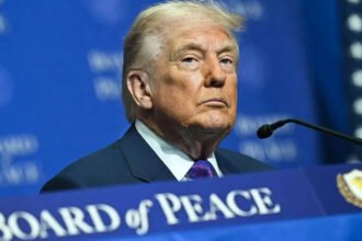 Trump’s Foreign Policy Dilemma Deepens Amid Rising Iran Tensions Tensions between the United States and Iran have put President Donald Trump’s foreign policy back in the spotlight. During a recent meeting of the Board of Peace, a Middle East coalition he created, Trump delivered a fresh warning to Tehran. He called for peace but also threatened military action. That contrast shows the core struggle shaping his second term. Diplomacy or Military Pressure? Trump says he prefers a diplomatic agreement that would end Iran’s nuclear weapons ambitions. A White House official recently said Iran would be “very wise” to reach a deal. However, the administration has increased pressure in recent weeks. Trump ordered a major military buildup in the Middle East. Analysts describe it as the largest US deployment in the region since the Iraq War in 2003. This approach raises questions. Trump often signals he wants negotiations. At the same time, he strengthens military options. That mix leaves allies and critics unsure about his final goal. The Shadow of Past Military Action Some observers argue that Trump uses strong language to gain leverage. Yet recent history suggests his threats carry weight. Earlier this year, the US carried out an operation against Venezuela. That mission led to the capture of former President Nicolás Maduro. The administration defined the objective narrowly and claimed success. Iran presents a more complex challenge. Trump insists that a US strike last June “obliterated” Iran’s nuclear facilities. If that is true, critics ask why another strike would be necessary. The White House has not clearly explained its new targets or expected results. Nuclear Talks at a Standstill Washington and Tehran have held indirect talks. These discussions focus on uranium enrichment and Iran’s nuclear programme. Iran has signaled openness to negotiations. However, talks have stalled. The US wants Iran to limit its ballistic missile programme and reduce support for proxy groups across the region. Sanctions and domestic protests have weakened Iran’s leadership under Supreme Leader Ayatollah Ali Khamenei. Even so, Tehran has not agreed to broader US demands. The diplomatic path remains uncertain. Strategic Risks and Regional Impact A new US strike could trigger serious consequences. Iran may target American military bases in the region. A prolonged conflict could also disrupt US goals in the Middle East. That includes efforts tied to rebuilding Gaza through the Board of Peace initiative. Israel’s role adds another layer. Israel joined the US in last year’s strike on Iran. Many expect Israel would participate again if Washington launches another campaign. That possibility increases the risk of wider regional escalation. Trump has not outlined a detailed post conflict plan. He has not clarified whether his administration seeks regime change or limited military objectives. Without clear answers, uncertainty continues to shape US Iran relations.