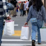 US consumer spending stalled in December, reflecting cautious consumer behavior amid inflation and slower wage growth.