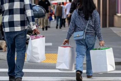 US consumer spending stalled in December, reflecting cautious consumer behavior amid inflation and slower wage growth.