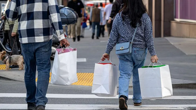 US consumer spending stalled in December, reflecting cautious consumer behavior amid inflation and slower wage growth.