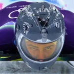 Ukrainian Skeleton Racer Wears Helmet Tribute Despite IOC Ban Ukrainian skeleton racer Vladyslav Heraskevych has chosen to wear a special helmet honoring athletes killed during Russia’s invasion of Ukraine, even after the International Olympic Committee (IOC) told him not to. He said he will continue wearing it on race days, insisting that the athletes he commemorates “deserve to be on the track.” Helmet Honors Fallen Athletes Heraskevych’s helmet features images of athletes, some of whom were his friends. Among them are teenage weightlifter Alina Peregudova, boxer Pavlo Ishchenko, and ice hockey player Oleksiy Loginov. He believes the helmet keeps their memories alive and highlights their connection to the Olympic movement. “Some of them were part of the Olympic family,” he said. “I believe they deserve to be here.” IOC Response and Rules The IOC has reminded Heraskevych that Rule 50.2 of the Olympic Charter prohibits political, religious, or racial propaganda in Olympic venues. Officials suggested wearing a black armband instead to honor the fallen athletes. IOC spokesperson Mark Adams said Heraskevych could show the helmet in mixed zones and on social media, but not while competing. He added, “We want him to compete. All athletes deserve their moment on the track.” The IOC has not confirmed if Heraskevych would face disqualification for continuing to wear the helmet. Athlete’s Stand Despite the IOC’s guidance, Heraskevych feels his helmet does not break the rules. He argued, “I believe we have all the rights to wear this helmet in competition because it is fully compliant with the rules. There aren’t enough black bands to honor all of these athletes.” Precedent of IOC Disqualifications The IOC has previously disqualified athletes for displaying political messages. For instance, Afghan breakdancer Manizha Talash, representing the Refugee Olympic Team in Paris 2024, was removed for wearing a 'Free Afghan Women' slogan during a pre-qualifier dance battle. Upcoming Races The men’s skeleton heats start Wednesday, with final runs scheduled for Friday. Heraskevych’s helmet tribute is set to draw attention while reminding the world of the lives lost during the invasion.
