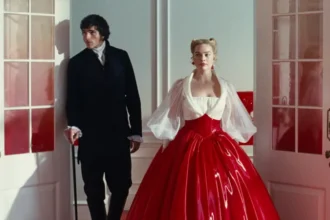 Wuthering Heights Remake Sparks Mixed Reviews Ahead of Valentine’s Release Emerald Fennell’s much-anticipated take on Wuthering Heights, starring Australian stars Jacob Elordi and Margot Robbie, is dividing critics just days before its Valentine's weekend release. The film reimagines Emily Brontë’s classic tale of obsession, revenge, and passion, centering on the intense relationship between Cathy and Heathcliff. Critics Divided: Praise vs Criticism The Guardian’s Peter Bradshaw criticized the film as an "emotionally hollow, bodice-ripping misfire," giving it just two stars. He described Fennell’s approach as over-the-top, calling it "a 20-page fashion shoot of relentless silliness," complete with ripped bodices and hints of BDSM. On the other hand, Robbie Collin of the Telegraph awarded it five stars, calling it "resplendently lurid, oozy, and wild." Collin defended the film against claims of style over substance, arguing that Fennell proves style can enhance the story. According to him, Cathy and Heathcliff’s emotions shine through their clothing, settings, and every cinematic detail. A Bold, Stylized Take The film, set in the late 18th and early 19th century, stars Elordi, 28, and Robbie, 35, as the iconic lovers. Fennell markets it with quotation marks around the title, signaling her personal interpretation of Brontë’s novel. Adding to the film’s modern edge, pop singer Charli XCX created an original soundtrack. Some critics, like Dulcie Pearce from the Sun, compared the film’s drama to a Mills & Boon romance, claiming it prioritizes sex over story. Clarisse Loughrey from the Independent was harsher, giving the film one star. She argued the adaptation pushed the lead performances toward pantomime while portraying the poor as sexual deviants and the wealthy as clueless. Mixed But Memorable Other reviewers offered more balanced takes. Danny Leigh of the Financial Times gave it three stars, describing the sexual tension as a mix of arthouse style and comedy reminiscent of a Carry On film. Similarly, Donald Clarke from the Irish Times praised the adaptation’s narrative structure, noting its surprising loyalty to Brontë’s original story. Empire’s Beth Webb also awarded three stars, calling it "undeniably expertly crafted" and highlighting Elordi’s rising star power, though she wished the film’s energy lasted throughout. Conclusion Fennell’s Wuthering Heights is a polarizing cinematic experiment. Some view it as a bold, stylish reinvention that captures the raw passion of Brontë’s characters, while others feel it sacrifices depth for visual flair. Audiences are likely to leave the theater either enthralled or underwhelmed.