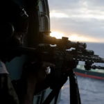 U.S. troops descending from helicopter to board Aquila II tanker