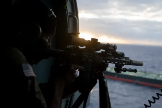 U.S. troops descending from helicopter to board Aquila II tanker