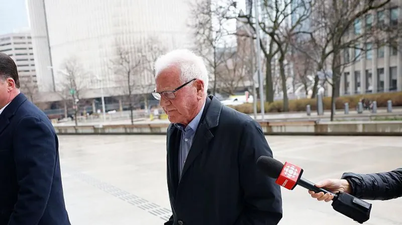 Frank Stronach arriving at Toronto courthouse for sexual assault trial