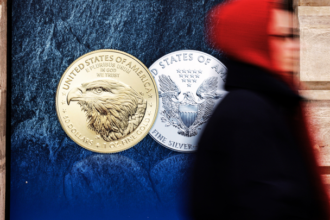 Gold and silver bars with stock market graph overlay showing a decline