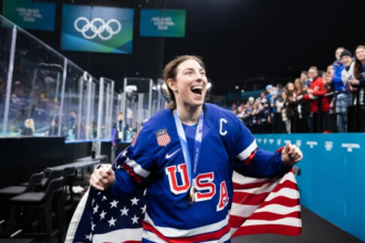 Hilary Knight celebrating Olympic gold after proposing to Brittany Bowe