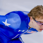 Jordan Stolz racing on ice during speedskating competition
