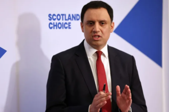 Keir Starmer speaking at press conference with cabinet ministers in support