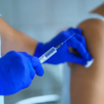 Moderna logo with text “mRNA flu vaccine” against FDA building backdrop