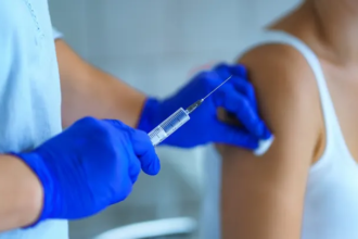 Moderna logo with text “mRNA flu vaccine” against FDA building backdrop