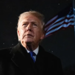 Marjorie Taylor Greene speaking at an event while Donald Trump looks on