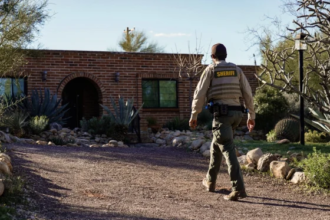 Masked person tampering with door camera at Nancy Guthrie’s Arizona home