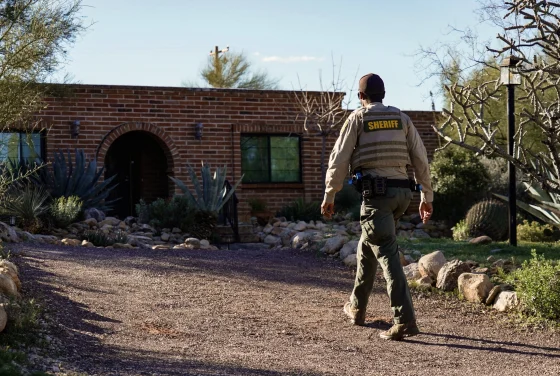 Masked person tampering with door camera at Nancy Guthrie’s Arizona home