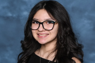 Ofelia Torres smiling with her father Ruben Torres Maldonado