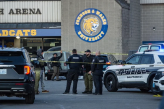 Police vehicles outside Dennis M Lynch Arena after shooting at Rhode Island high school hockey game