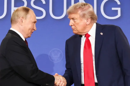 Russian and U.S. flags with nuclear missile in background