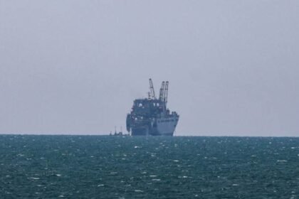 U.S. military team boarding the Aquila II oil tanker from a helicopter in the Indian Ocean