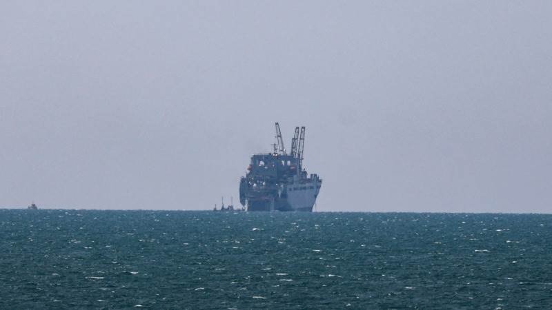 U.S. military team boarding the Aquila II oil tanker from a helicopter in the Indian Ocean
