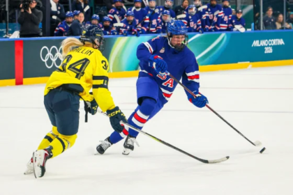 Team USA women’s hockey players celebrate a goal against Sweden at the 2026 Olympics