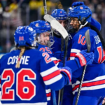 U.S. women’s hockey team celebrating after defeating Sweden to reach the Olympic gold medal game