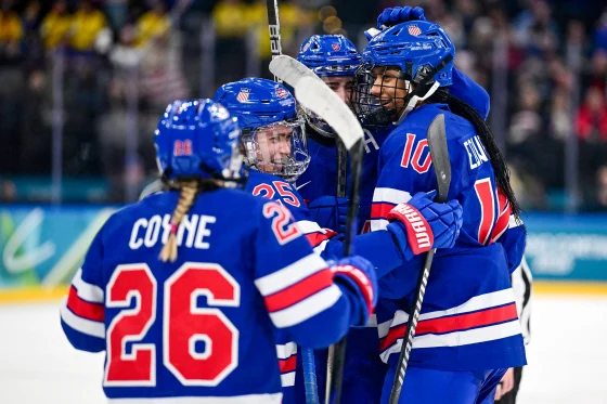 U.S. women’s hockey team celebrating after defeating Sweden to reach the Olympic gold medal game