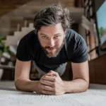 Isometric Exercises: A Simple 14-Minute Routine That Can Boost Heart Health A smarter way to stay fit Most people picture intense workouts when they think about fitness. Long gym sessions, running on treadmills, or lifting heavy weights often come to mind. But new research suggests you don’t always need that level of effort. In fact, you can improve your health by staying still. Isometric exercises focus on holding a position without moving. Simple examples include holding a squat, pressing your hands together, or sitting with one leg extended. These small efforts can still make a big impact on your body. What research shows A large analysis in 2023 reviewed studies from 1990 to 2023, covering nearly 16,000 people. It compared different types of exercise and their effect on blood pressure. The routine used in most trials was short and practical. It involved four sets of two-minute holds, with short rest periods in between. The full session lasted about 14 minutes and was done three times a week. The results were clear. Isometric exercises reduced blood pressure more than cardio, weight training, and even high-intensity workouts. On average, blood pressure dropped by about 8.24 over 4.00 mmHg. That is close to the effect of some medications. Why it works When you hold a position, your muscles tighten without changing length. This pressure limits blood flow for a short time. Your body responds by working harder to send oxygen to the muscles. Once you relax, blood flow increases again. Repeating this process helps improve how your blood vessels function. Over time, this can lower blood pressure and support heart health. More than just heart benefits Isometric exercises also build strength. They activate motor units, which are groups of nerves that control muscle contraction. This improves how effectively your muscles work. They can also help reduce stiffness in blood vessels and support overall heart function. Another advantage is safety. These exercises are often easier on joints, making them suitable for people who struggle with movement-based workouts. Easy to start, easy to maintain One of the biggest benefits is convenience. You don’t need equipment or a gym membership. You can do these exercises at home, even in a small space. Because sessions are short and low effort, it’s easier to stay consistent. This makes isometric training a good option for busy people or beginners who find it hard to stick to regular workouts.