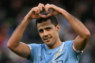 Rodri Open to Real Madrid Move Despite Atletico Past Manchester City midfielder Rodri has hinted that his past at Atletico Madrid would not stop him from joining Real Madrid in the future. The 29-year-old Spanish international stated, "you can't turn down the best clubs in the world." Since moving to City from Atletico in 2019, Rodri has made 293 appearances and won 12 major trophies under Pep Guardiola, including four Premier League titles and one Champions League. Contract Situation Rodri's contract with Manchester City expires next summer. He said he plans to "sit down and talk" with the club but admitted he would like to return to Spain eventually. Considering Real Madrid Despite playing 47 times for Atletico, Rodri did not rule out joining City’s city rivals, Real Madrid. He noted that many players have made similar moves over time. Examples include Thibaut Courtois and Alvaro Morata, who both played for Atletico and Real Madrid after stints in Chelsea. Rodri addressed reports that Real president Florentino Perez admires him, saying, "I don't know – they don't talk to me directly. They'd talk to my agent." Recent Career and Fitness Rodri has featured in 18 Premier League matches this season, returning from a ruptured anterior cruciate ligament suffered in 2024. Internationally, he has earned 59 caps for Spain and helped his country win the 2024 European Championship and the 2023 Nations League. He has been called up by Luis de la Fuente for upcoming friendlies against Serbia and Egypt as he targets a spot in this summer’s World Cup in the US, Mexico, and Canada. Rodri's comments suggest that a future move to La Liga remains a possibility, even with his Atletico history. His experience and success at City make him a coveted player for top European clubs.