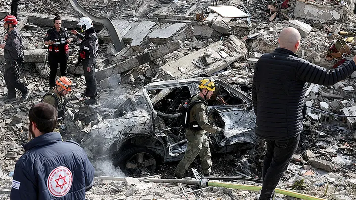 Residents in Tel Aviv entering a reinforced shelter during repeated Iranian missile sirens