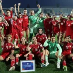 Afghanistan Women Football Team Returns to International Stage After FIFA Decision FIFA Approves Return Under Special Rules FIFA has approved a new rule that allows Afghanistan women footballers to return to international competition under special circumstances. The decision enables players to represent their country even when their national federation cannot officially support a team. This change follows years of restrictions after the Taliban took control of Afghanistan in 2021. Women were banned from sports, and many footballers left the country to seek safety abroad. Players Forced Into Exile After 2021 Afghanistan women last played an official match in 2018. After 2021, women faced strict limits on sport and public participation. Many national team players relocated to countries such as Australia, the United States, Europe, and the Middle East. More than 80 Afghan women footballers now live outside Afghanistan. Some were under contract before the political change, while others joined later as refugees. Formation of Afghan Women United FIFA supported a refugee team called Afghan Women United in 2025 as part of a pilot program. This team gave displaced players a platform to compete and stay active in international football. The team has already played friendly matches. It recorded its first win against Libya during the FIFA United Women Series in 2025. New Pathway for International Matches The updated FIFA rule allows a national or representative team to compete even when the member federation cannot officially register it. This ensures players are not blocked from football due to political or external conditions. Afghanistan will not take part in the 2027 Women's World Cup. However, the team may join qualification matches for the 2028 Olympics. Their return to international fixtures is expected in June. Leadership and Player Response Former captain Khalida Popal welcomed the decision and said the team represents strength and hope for Afghan women. She highlighted that players inside Afghanistan still face major restrictions. She said the team will continue to speak for those who cannot leave the country and will support young players in exile communities. Training and Preparation Plans FIFA has organized regional selection camps in England and Australia. A training camp in New Zealand is also planned for June. These camps will help prepare the squad for upcoming international matches.