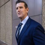 Ben Roberts Smith Released on Bail in War Crimes Case Bail granted after custody Australia’s most decorated living soldier, Ben Roberts Smith, has been released on bail after spending time in custody over serious war crime allegations. He left Silverwater Prison in Sydney after a court approved his release under strict conditions. Murder charges linked to Afghanistan service The former SAS corporal faces five counts of murder as part of a war crimes investigation. Prosecutors allege he was involved in the killing of unarmed Afghan detainees between 2009 and 2012. They also claim he either carried out the killings or ordered subordinates to do so. Roberts Smith denies all allegations against him. Court decision and bail reasoning Judge Greg Grogin said the case is unusual and could take years to reach trial. He noted Roberts Smith may remain in custody for a long time if bail was refused. The judge accepted that conditions could manage risks such as witness interference or flight. Bail conditions imposed The court set strict rules for his release. He must report to police three times a week and allow access to his electronic devices. His passport has been cancelled, and he cannot leave Australia. A surety of A$250,000 was also ordered. The judge warned that any breach would lead to immediate arrest. Legal background and defamation case The criminal charges follow a 2023 civil defamation case brought by Roberts Smith against Nine newspapers. The court found, on the balance of probabilities, that some murder allegations had substantial truth. That civil trial was the first time an Australian court examined claims of war crimes involving Australian forces. Upcoming legal battle The upcoming criminal trial will require proof beyond reasonable doubt, a much higher legal standard than the civil case. His legal team argues the case is complex and unprecedented in Australia. They also claim intense media coverage could affect his right to a fair trial.